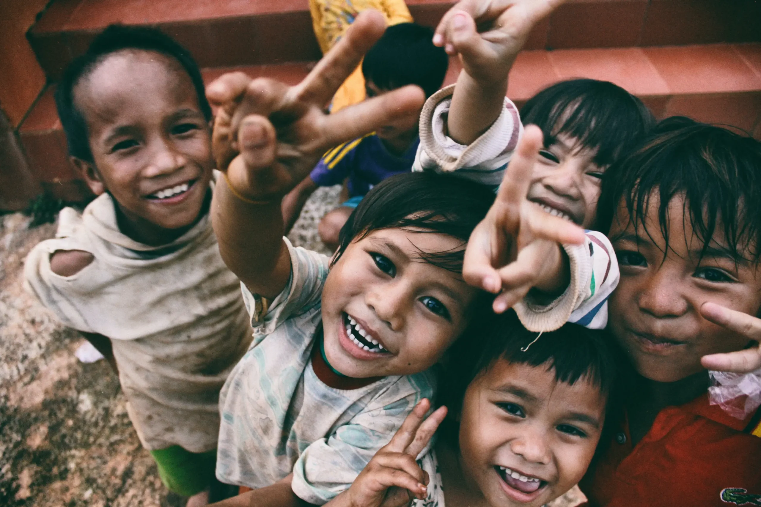 a group of children standing next to each other